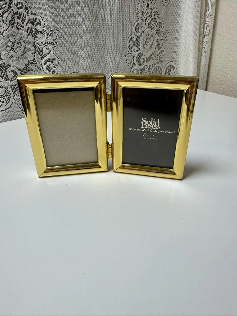 Vintage Gold Colored Solid Brass Double Hinged Picture Frame. Each is 2”x3”.